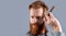 man shaving with barber blade isolated on grey background with copy space.