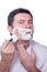 Man shaving beard