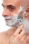 Man shaving with a razorblade