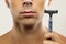 Man during shaving routine with a safety razor