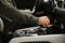 Man shifting gears in car, closeup. Driving test