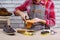 Man shining shoes with a rag and cream, wax.