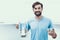 Man in Shirt Drinking Water in Kitchen at Home.