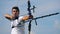 A man is shooting from his compound bow. Shooting with a bow and arrows.