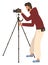 Man Shooting Videos or Photos by Camera on Tripod