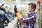 Man shopping for angle grinder in hardware store