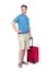 Man in shorts, blue t-shirt stands with a red suitcase, isolated on white background. Passenger with luggage