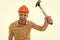 Man shouting. Man builder hard hat. Threaten with hammer. Angry aggressive guy. Improvement and renovation. Man builder