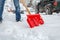 Man shoveling snow on road