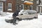 Man shovelling and removing snow