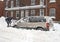 Man shovelling after snowstorm