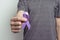 Man showing blue violet ribbon. Awareness ribbon
