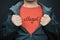 A man showing his t-shirt with the word illegal on it