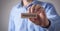 Man showing Practice word on wooden block