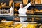 Man shows a selection of baguettes and loaves