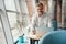 Man signs papers in a coworking space among plants