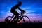 Man silhouette cycling on twilight time