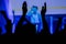 Man silhouette partying and clapping at rock concert