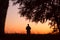 man silhouette solitary at sunset summertime