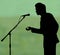 Man silhouette speech to microphone