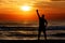 Man silhouette waving sun sunset sea