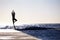 Man, silhouette and yoga in meditation on ocean at beach for spiritual wellness, inner peace or mental wellbeing space