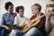 Man singing and playing guitar for his daughter and his wife