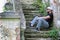 Man sit on abandoned stair