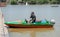 man sit in boat and talking on his mobile phone