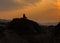 Man sit On rocks Silhouette