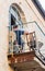 A man  sits on the balcony of his apartment and smokes a hookah in the Mamila quarter in Jerusalem, Israel