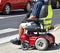 Man sits in an electric wheelchair