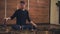 A man sits near the Tibetan singing bowls in the lotus position