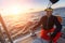 Man sits on yacht during sunset. Luxury sailing boats.