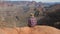 Man Sitting Alone On Edge Of The Abyss Looking Amazing View Of Grand Canyon