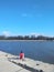 Man sitting alone on pier fishing