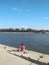 Man sitting alone on pier fishing activity on a sunny day -image