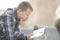 Man sitting on bench and reading bible