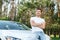 Man sitting on bonnet with crossed arms