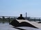 Man Sitting on a Boulevard River Bank and Enjoying Beautiful View at National Football Stadium