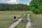 Man sitting on a country road after he fallen down