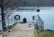 Man sitting dock lake spring sunshine Stockholm, Sweden