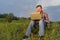 Man sitting on the grass with a laptop