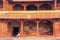 Man sitting in the inner courtyard of Jodh Bai Palace in Fatehpur Sikri, Uttar Pradesh, India