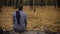 Man sitting in park alone, gray tones express depression, sadness, melancholy