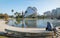 Man sitting at pond at Palau des Arts Reina Sofia in the City of Arts and Sciences in Valencia, Spain