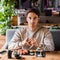 Man sitting in sushi bar near delicious meal