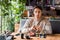 Man sitting in sushi bar near tasty meal