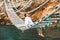 man sitting at suspension bridge enjoying sea view and nature calmness