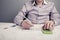 Man sitting at table looking at documents